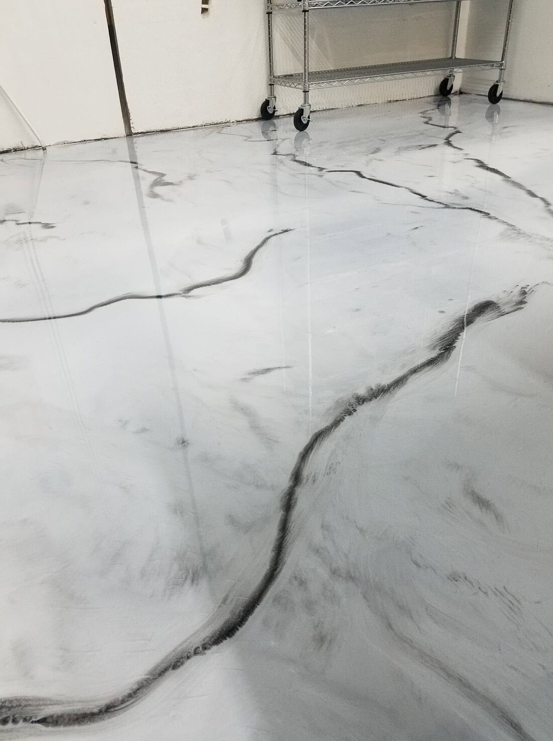 Large metallic epoxy showroom floor