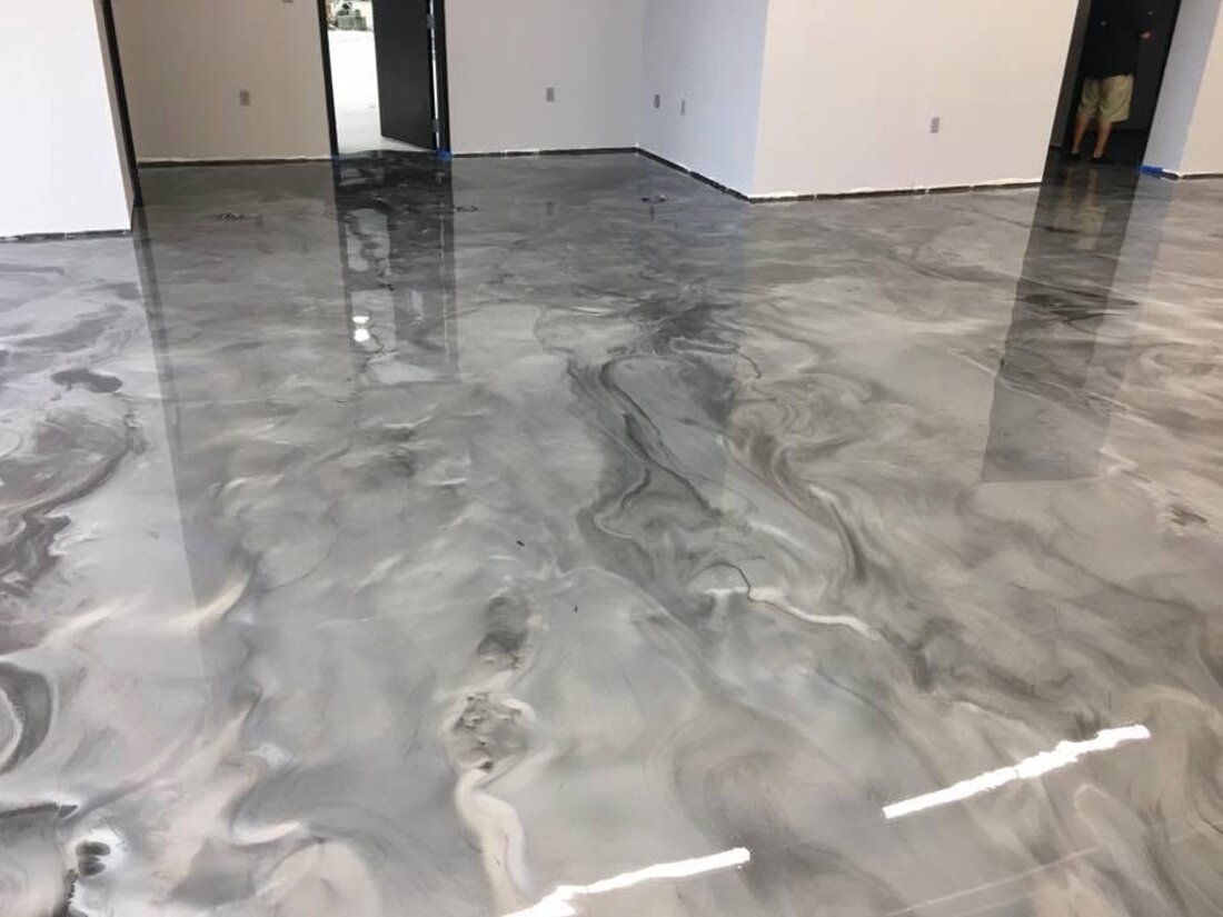 Large open room with gray metallic epoxy floor