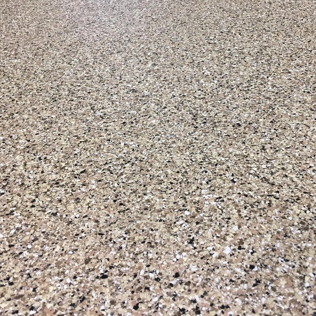 Close-up of speckled flake epoxy floor texture
