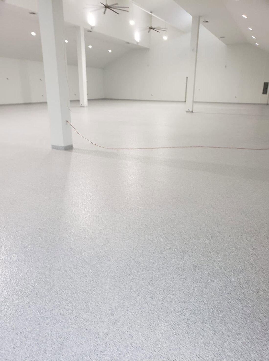 Large warehouse flake epoxy floor with columns